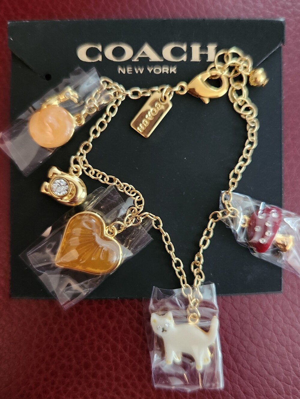 Coach Gold-Tone Bracelet with Red and White Enamel Mushroom Charm